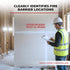 Person in safety gear inspecting a fire barrier on a construction site