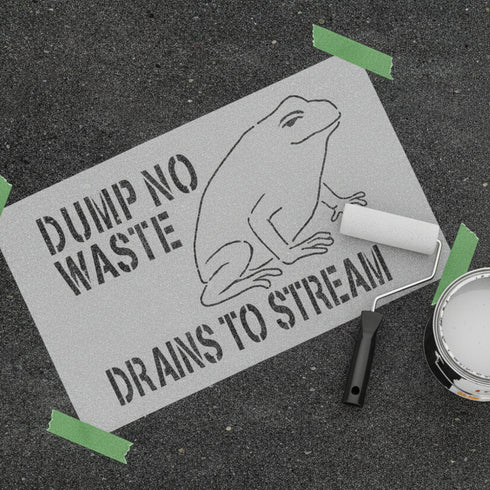 Dump No Waste Stencil being painted onto asphalt