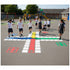 Children playing hopscotch on a playground with colorful grid markings.