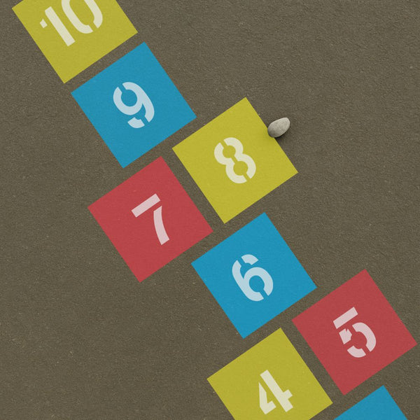 Colorful hopscotch grid with numbers on a brown background