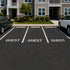 Guest Stencil applied to the parking spaces in an apartment building parking lot.