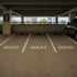 Guest Stencil applied to the parking spaces in a parking garage