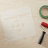 Card with 'Center of Gravity' text on a cardboard background