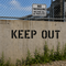 Keep Out Stencil used on a concrete wall in front of private property.