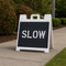 Slow Stencil that was used to make a temporary sign and placed on a sidewalk.