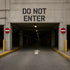 Concrete entrance with 'Do Not Enter' sign and arrow on pavement