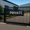 Private sign stencil applied to the front of a gate to signal private property