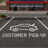 Store exterior with a 'Customer Pick-Up' area marked on the pavement.