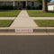 House with a sidewalk and 'GO BUCKS' sign on the street