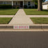 House with a sidewalk and 'GO BUCKS' sign on the street
