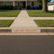 curb painted with the Go Big Orange Curb Painting Stencil
