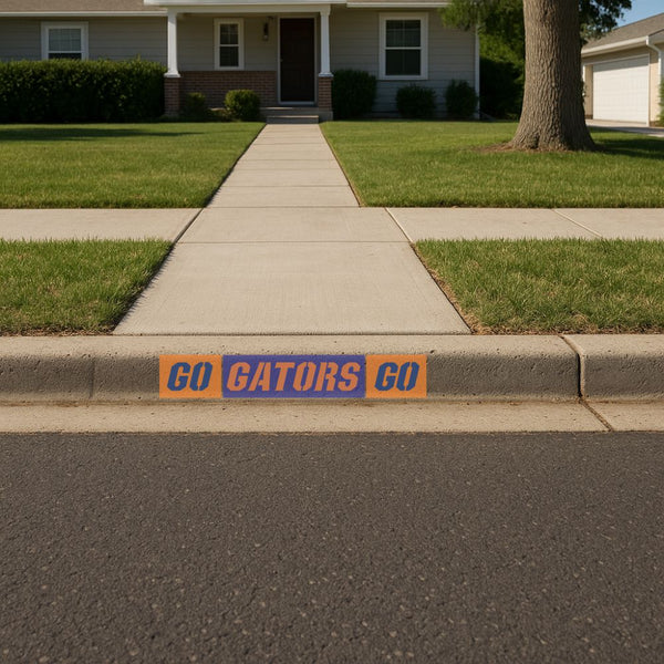 Curb painted with Go Gators Go curb marking stencils.