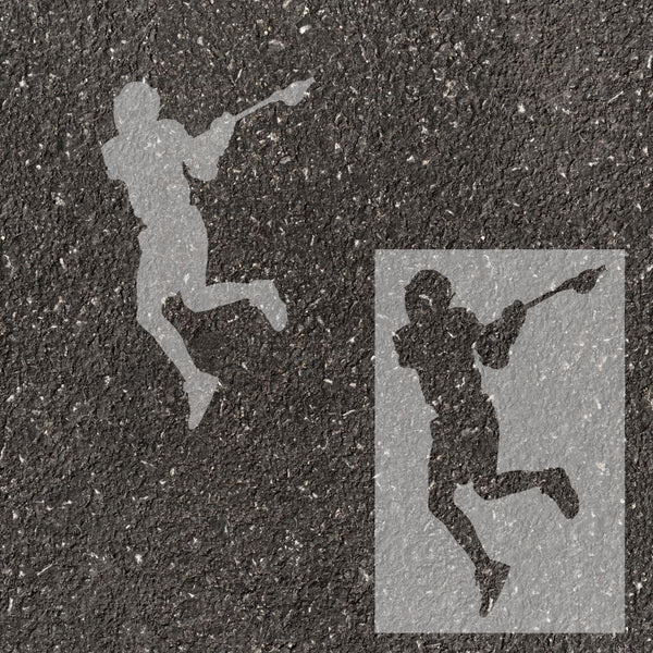 Men's lacrosse player silhouette stenciled on pavement with matching stencil.
