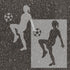 Women's soccer player silhouette stenciled on pavement with matching stencil.