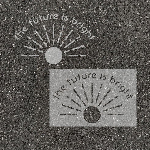 Text 'The Future is Bright' stenciled on pavement with matching stencil.
