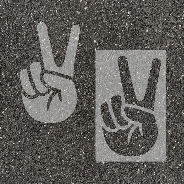 Peace stenciled on pavement with matching parking space stencil.