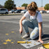 Stars stenciled on pavement with matching parking space stencil.