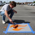 Flame stenciled on pavement with matching parking space stencil.