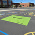 Playground with a large green mat displaying 'Wyoming Cheyenne' on an asphalt surface.