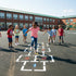 Children playing hopscotch on a school playground