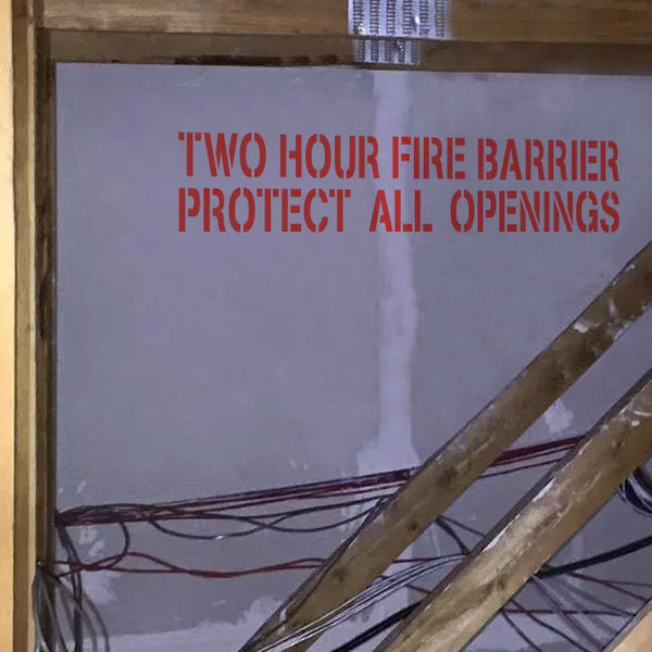 Two Hour Fire Barrier Protect All Openings Stencil Applied to a Wall