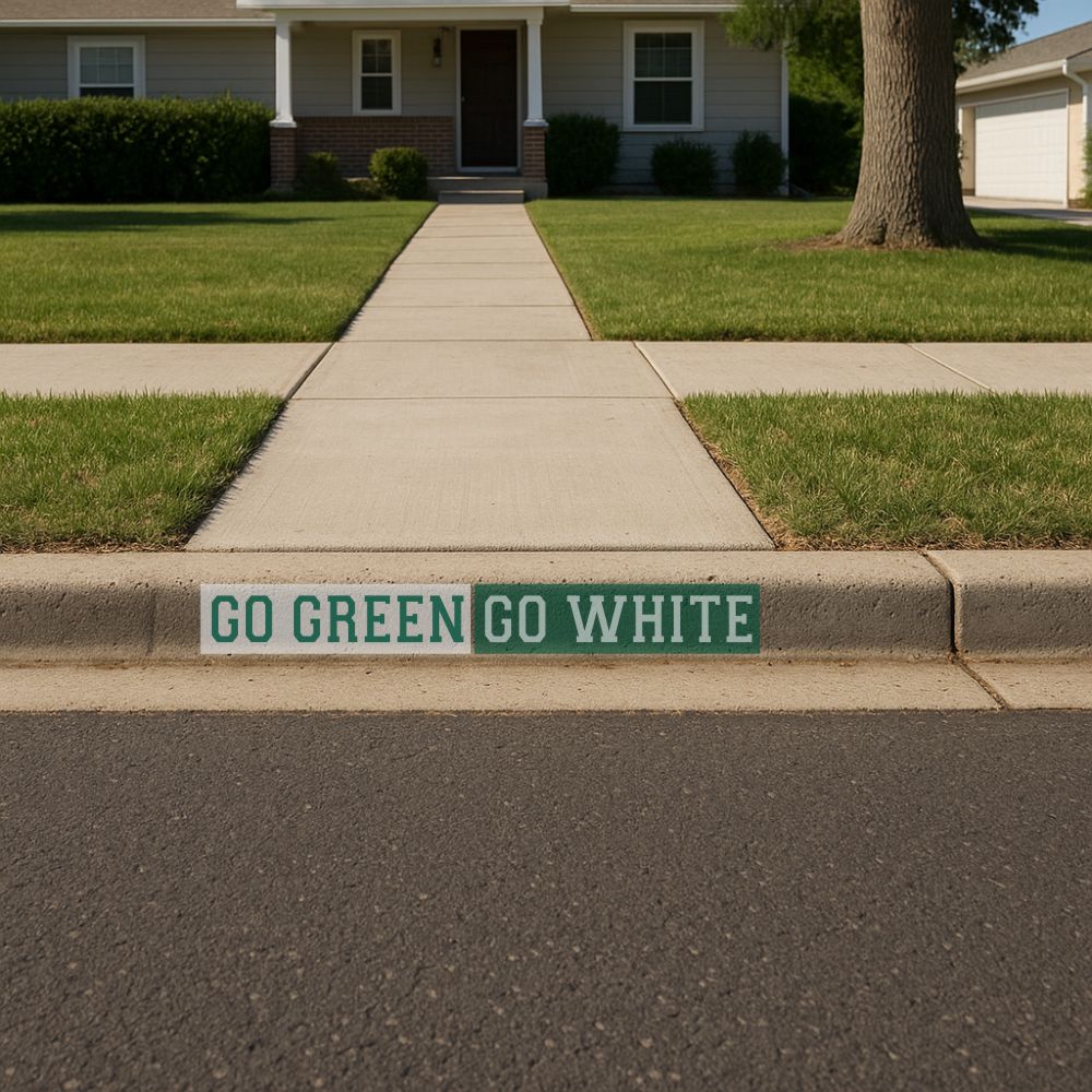 Go Green Go White Curb Painting Stencil that has been painted onto a residential curb.