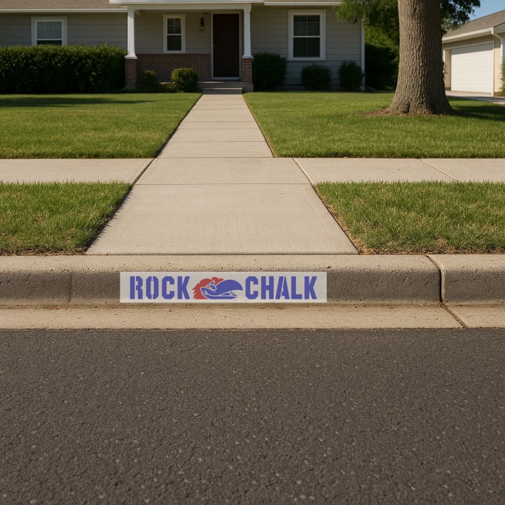 Residential curb painted with the Rock Chalk Curb Painting Stencils for Kansas Jayhawks.