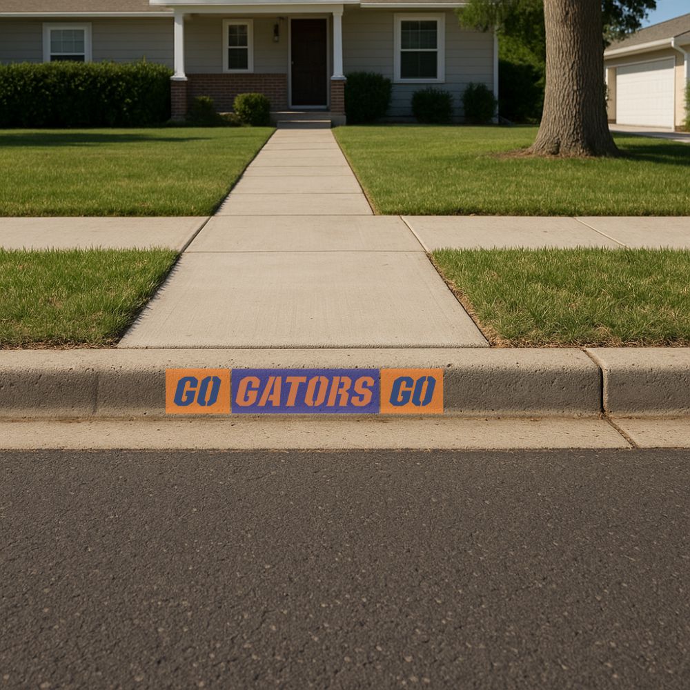 Curb painted with Go Gators Go curb marking stencils.