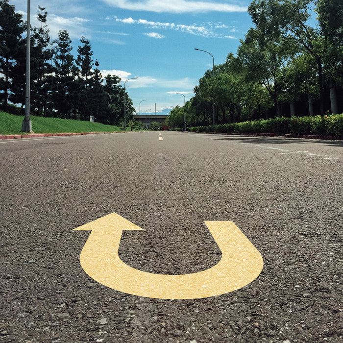 U-Turn Roadway Sign Symbol Stencil Painted onto a roadway